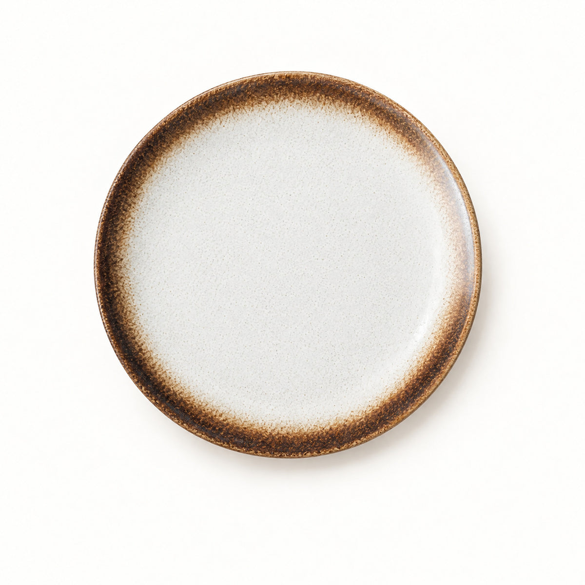 Japanese ceramic shallow plate with a cream centre and a warm toasted brown rim