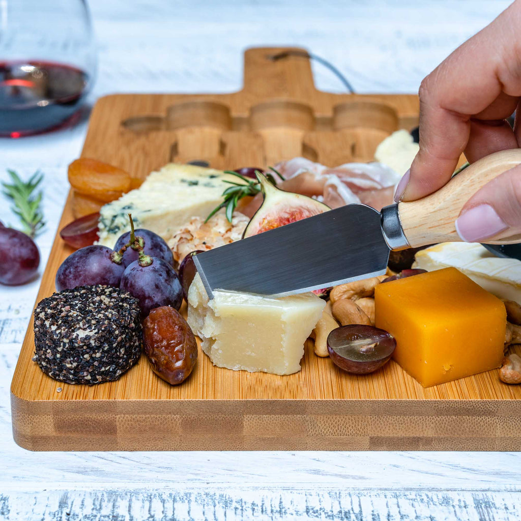 Bamboo cheese board and knife set with magnetic cutlery storage and handle — detail view