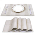 Cream textured faux leather placemats with plate and cutlery — alternate view