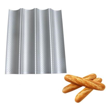 Perforated non-stick baguette baking pan with french bread loaves — view 6