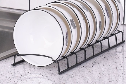 Minimalist stainless steel dish rack on kitchen counter — scale view