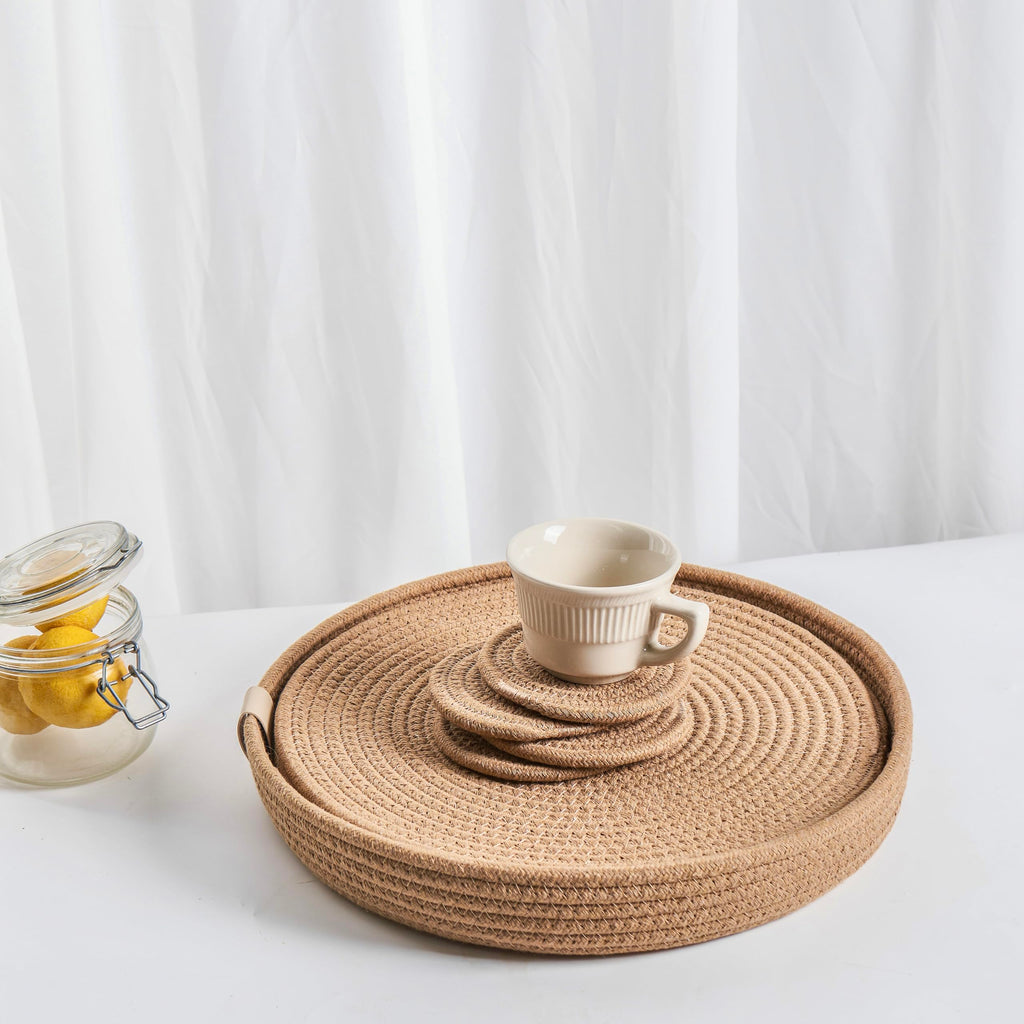 Round handwoven cotton rope placemats in light brown with matching coasters