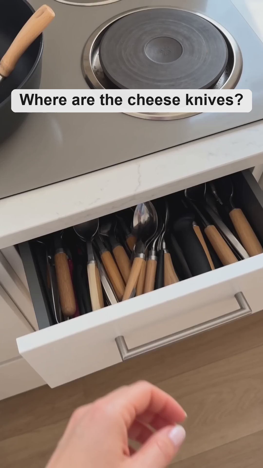 Bamboo cheese board in use: the three cheese knives lifted from their slots on the board