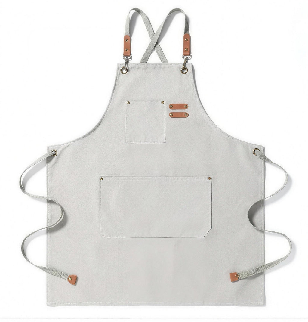 Artisan canvas kitchen apron with adjustable straps and front pockets