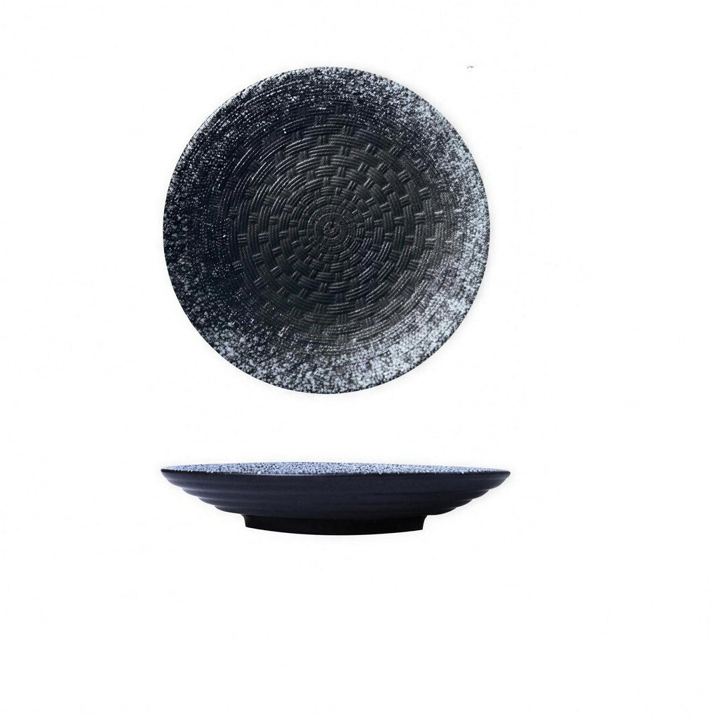 Woven-texture glazed ceramic dinner plate in black on a set table