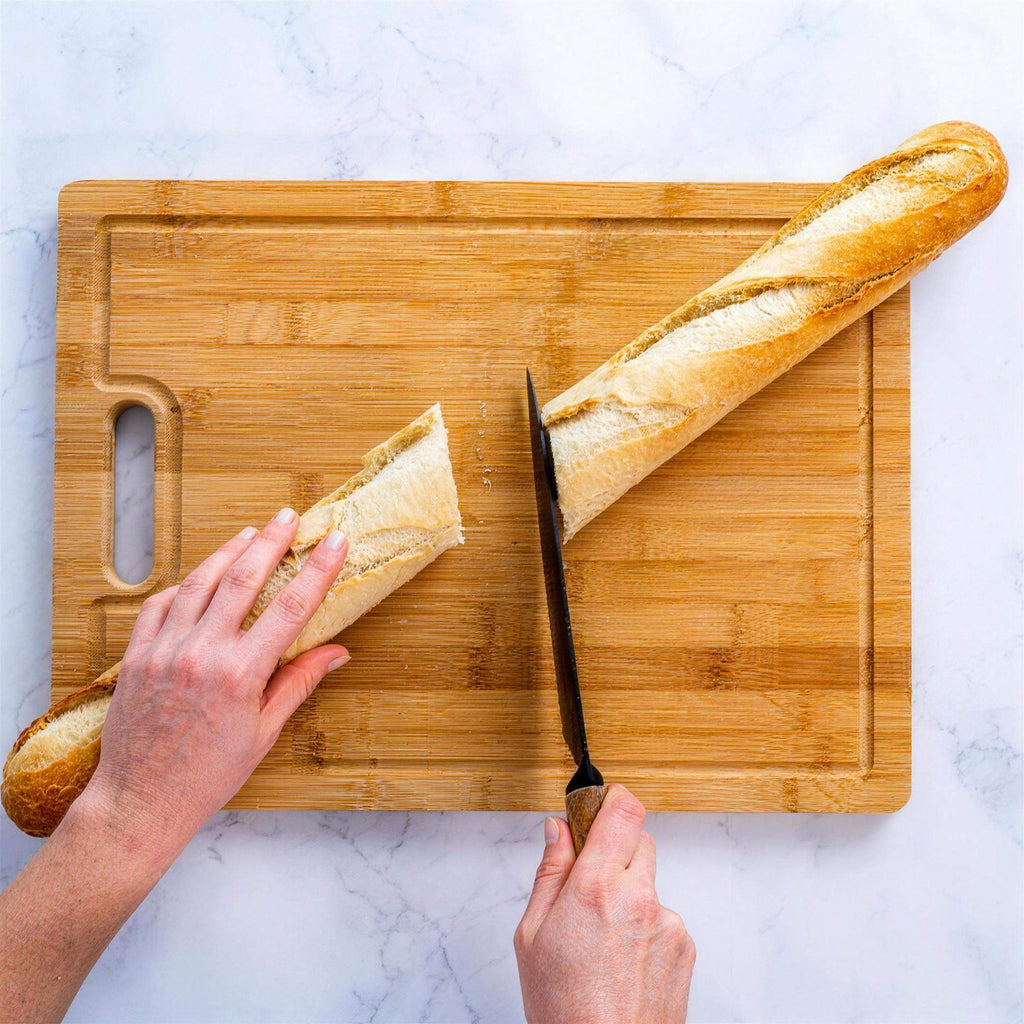 Extra-large bamboo cutting and serving board with juice groove and compartments — detail view