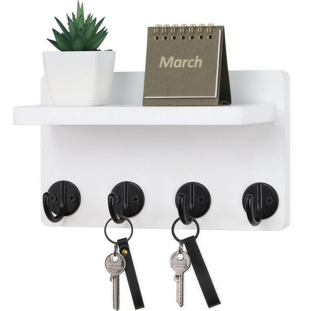 White wooden wall-mounted key holder with hooks and display shelf in entryway