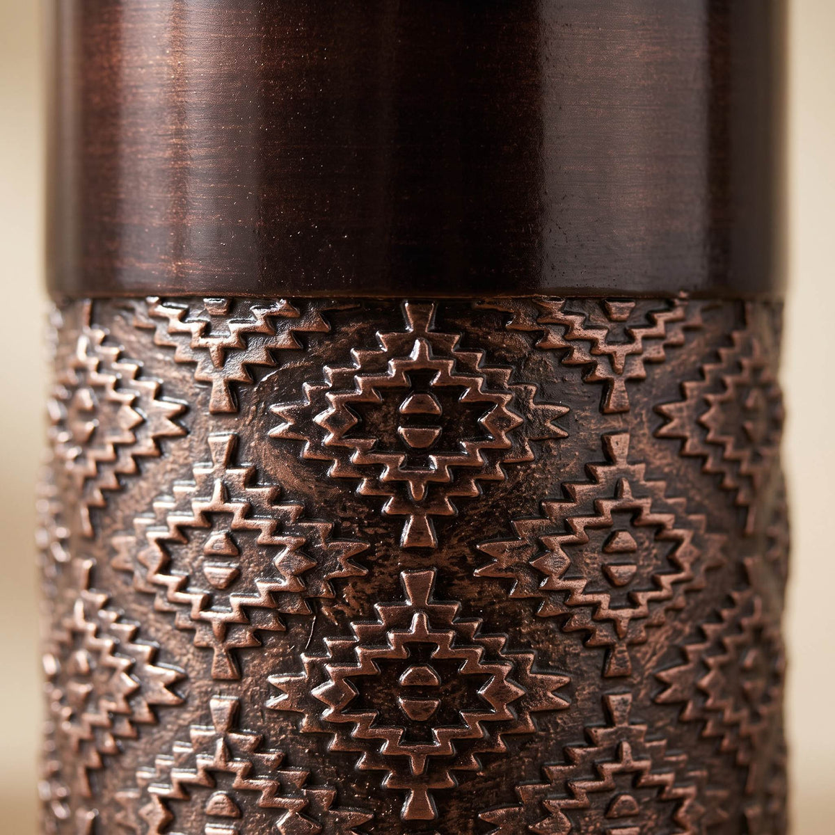 Faceted ceramic vase detail showing the diamond glazed surface catching light