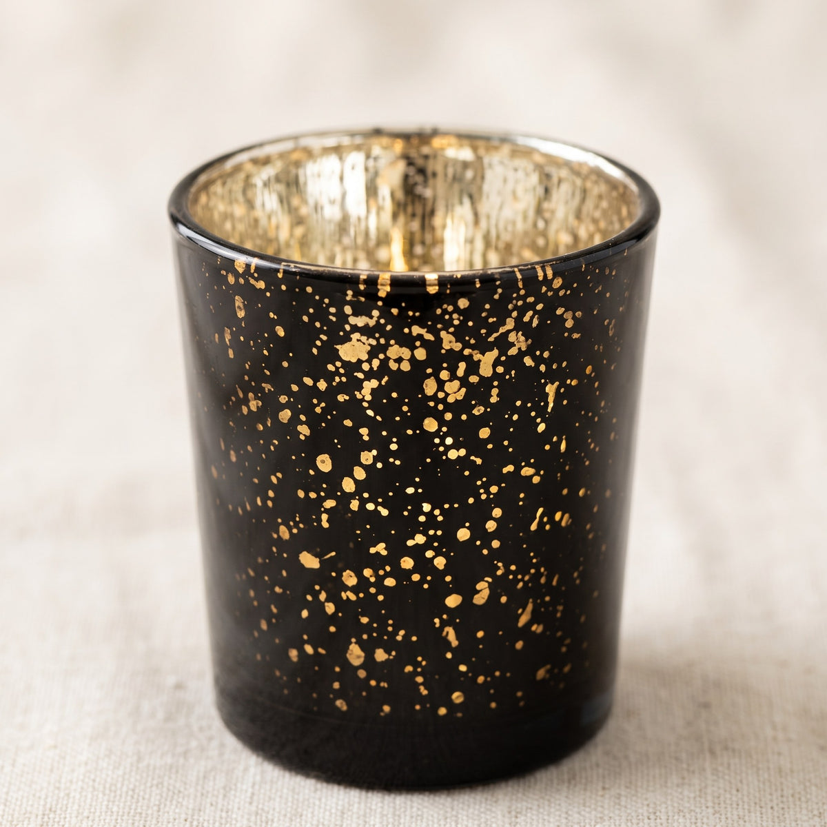 Black speckled votive holder detail showing the gold speckle texture on black glass